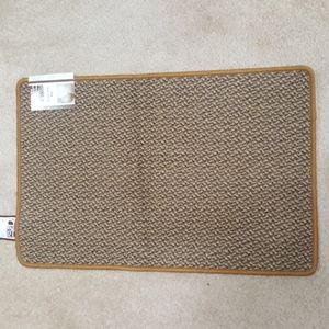 New throw mat mustard trim , colors are brown, mustard, tan with non-slip back